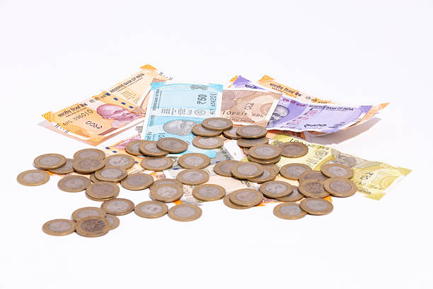Indian Old vintage coins, vintage coin abstract with English and Indian coins in forefront, Selective focus.