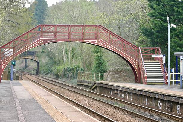 istock Footbridge over train track at station 2219607544