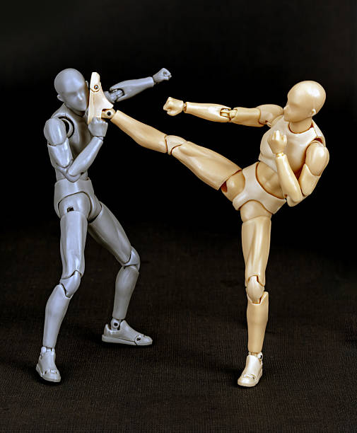 istock Batha Lup Phak (Foot Touching the Face) Figurines, 2 of 15 Standard Luk Mai Muay Thai Techniques. 2219607773