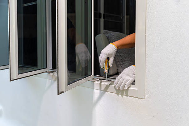 istock Handyman replace casement window stay friction. 2219608361