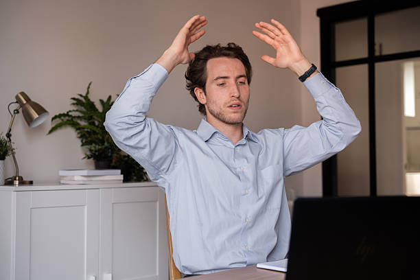 istock Businessman working, showing anger and frustration during his workday 2219608425