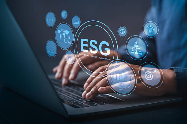 istock ESG concept with business professional using laptop. Focus on sustainability, ethical governance, and responsible investment in a digital business environment. 2219608988