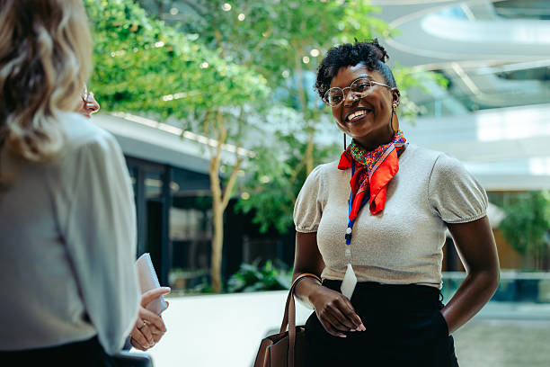 istock Confident financial analyst smiling during a business meeting in a modern office environment 2219610470