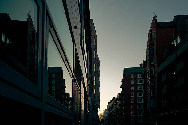 istock Low angle view of buildings in city during evening 2219615129