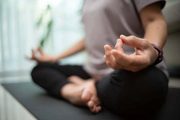 istock Mature woman meditation at home. 2219615134