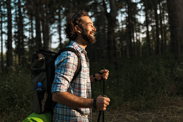 istock Adventurer Hiking Through Peaceful Woods 2219615702