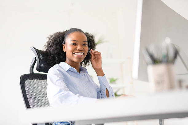 istock black business woman using laptop computer in office. 2219616720