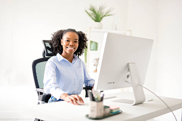 istock black business woman using laptop computer in office. 2219616722