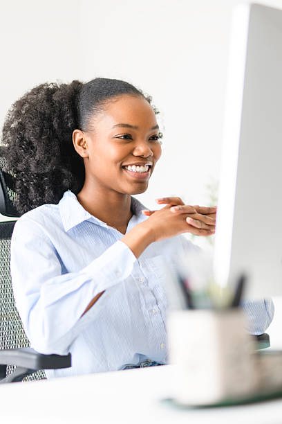 istock black business woman using laptop computer in office. 2219616729