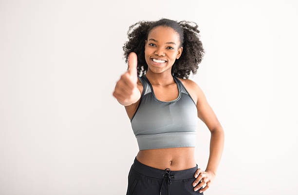 istock attractive black american woman training at home 2219616982