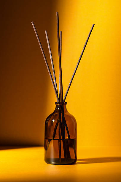 istock Amber glass diffuser bottle with fragrance sticks 2219619707