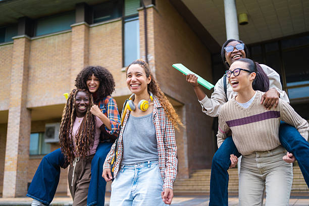 High school students, girls and happy with portrait for education, learning break and scholarship. Teenager, friends and smile with textbooks in hallway for study group, development and class recess