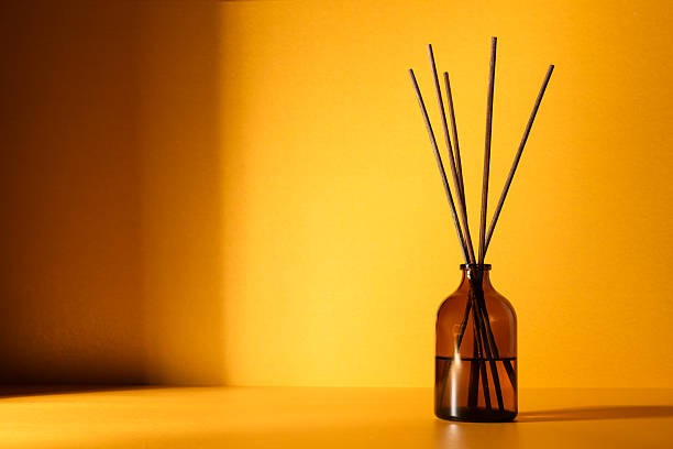Amber glass diffuser bottle with fragrance sticks