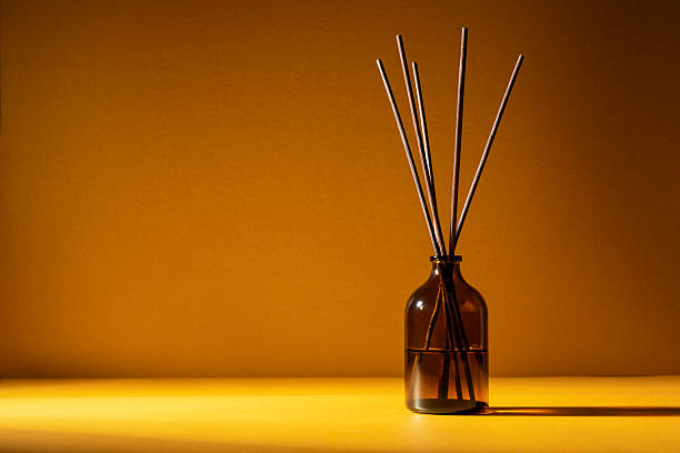 istock Amber glass diffuser bottle with fragrance sticks 2219619807