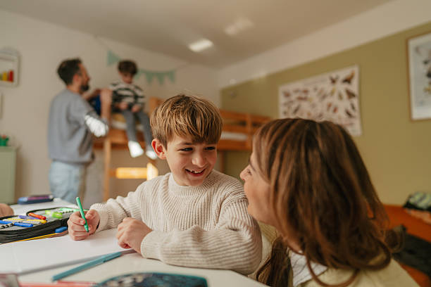istock Mom is helping me with homework 2219620395