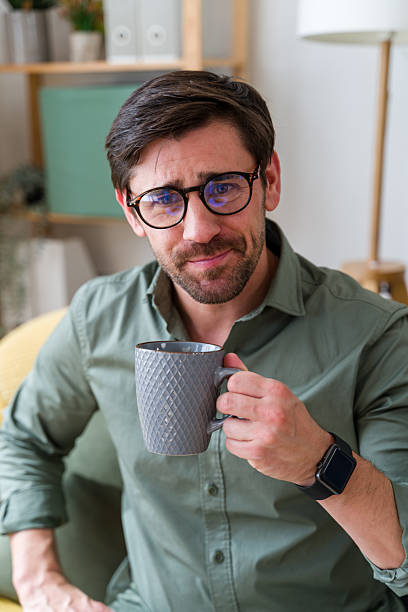 istock Man wearing glasses holding a mug 2219620727