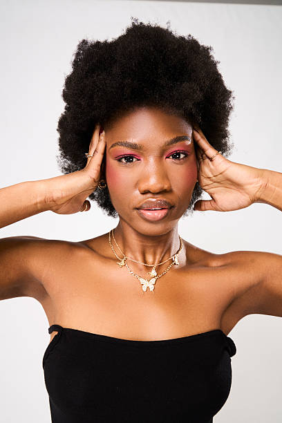 istock A young african woman posing in studio 2219620963