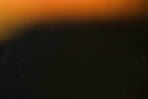 istock light leak overlay effect with scratch dust and light leaks,retro grain noisy film distressed texture light leak flare on black background 2219621240
