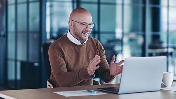 istock Smiling businessman having a video call 2219621373