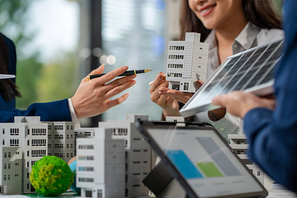 istock Engineer Teamwork Meeting, with partner on model building at company office working technology, Renewable energy-based green businesses and global warming 2219621937