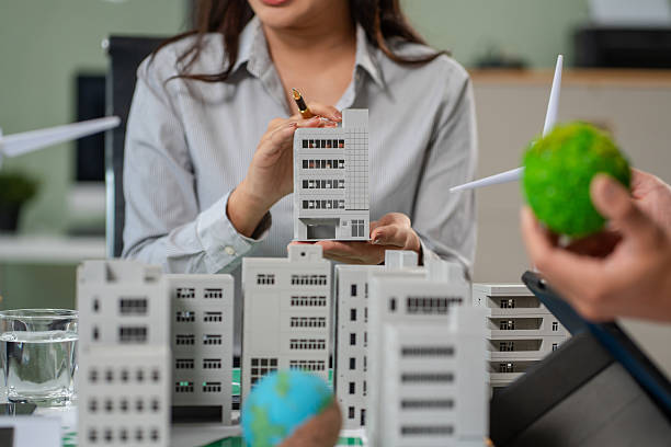 istock Engineer Teamwork Meeting, with partner on model building at company office working technology, Renewable energy-based green businesses and global warming 2219621945
