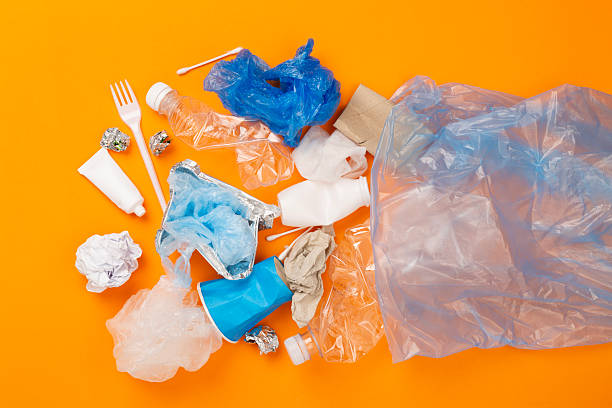 istock Bag with unsorted waste on color background, top view 2219623357
