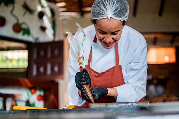 istock Mature female confectioner preparing chocolate at home 2219626948