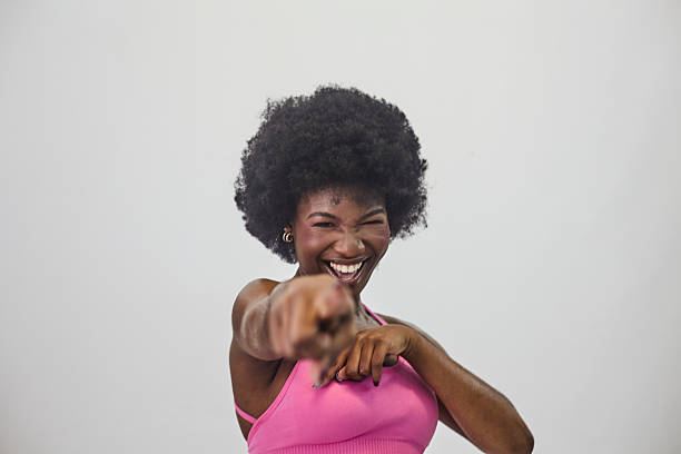 istock A young energetic woman in studio shot 2219633282