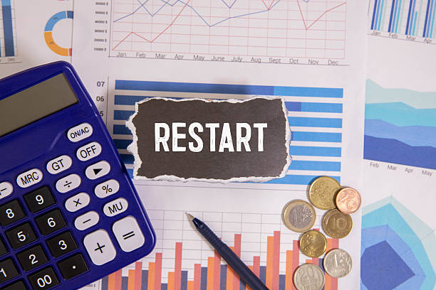 istock A row of wooden cubes with restart text on the table. 2219636246