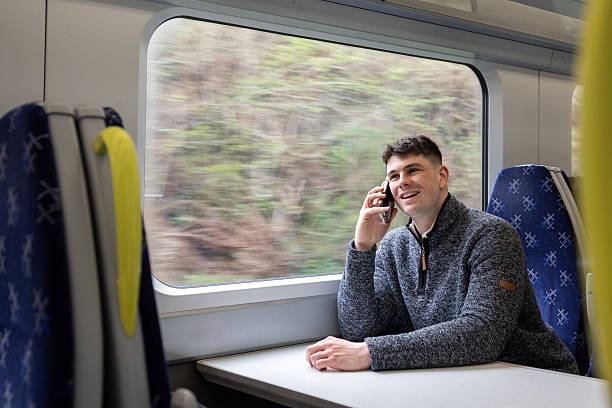 istock Talking on the Phone Whilst on the Train 2219636511