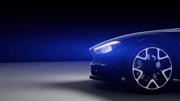 istock Generic modern sports car with glowing headlights in an empty showroom with blue light 2219638352