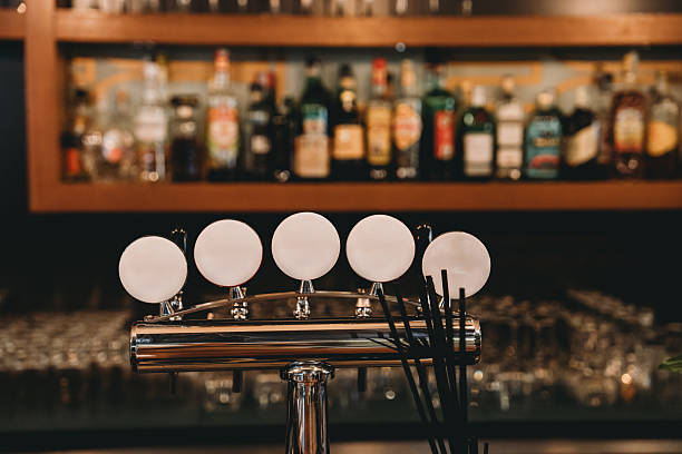 istock Beer taps in a row are waiting for customers in a pub 2219639912