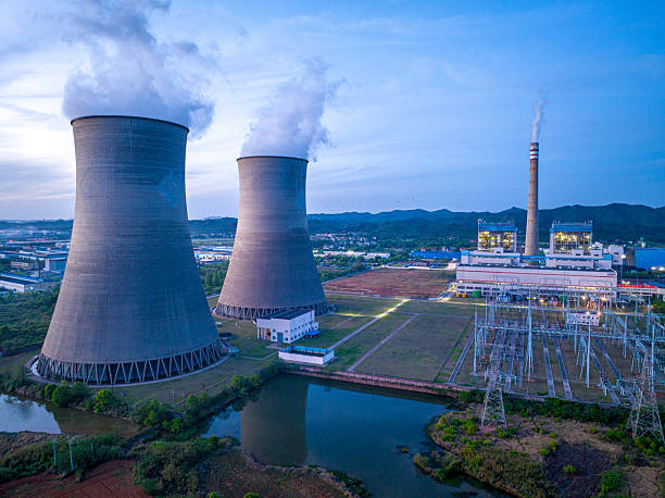 istock Thermal power plant generating electricity at night 2219639934