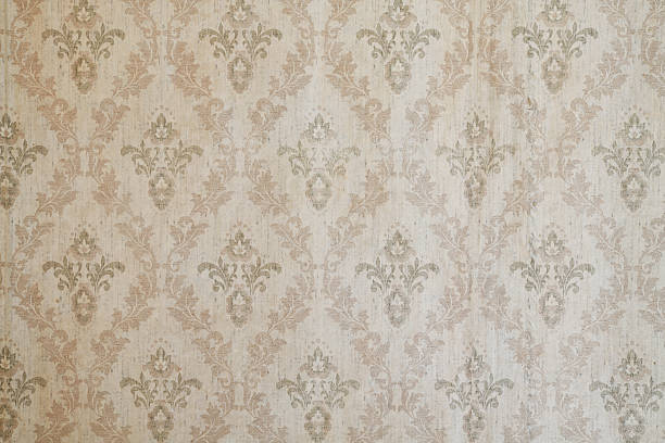 istock Old wallpaper on the wall. Old wallpaper for texture or background. 2219641638
