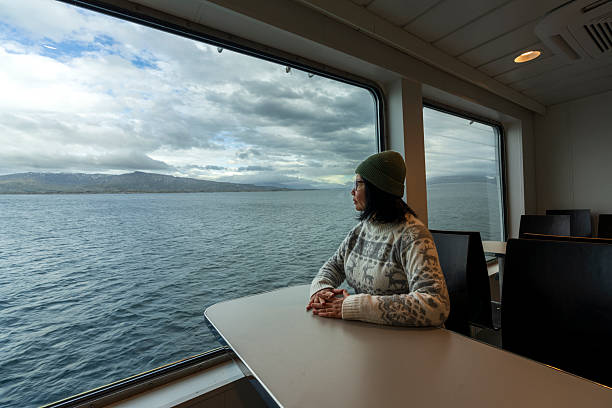 istock Woman looking at the ocean 2219642893