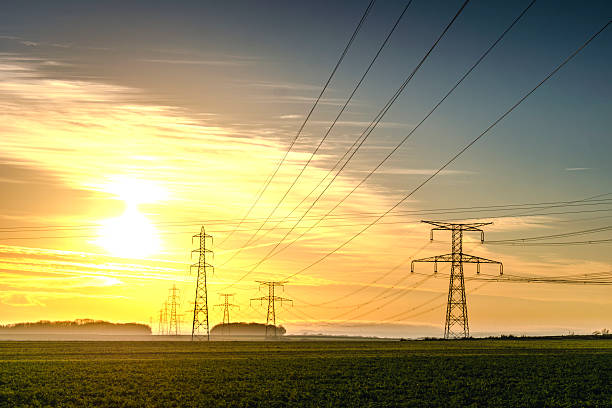 istock Sunrise with an electricity pylon and nature 2219643515
