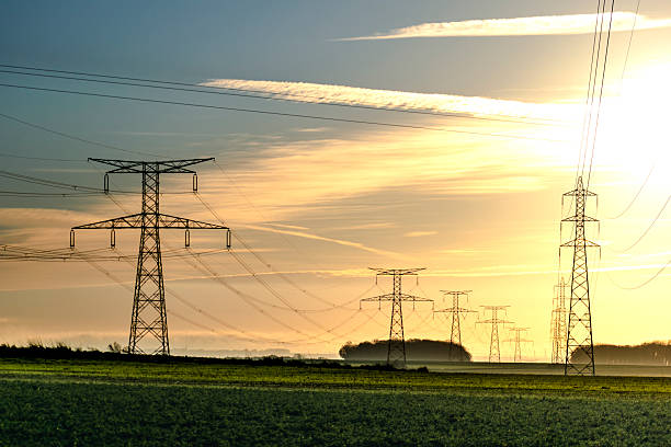 istock Sunrise with an electricity pylon and nature 2219643524