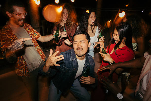 istock Multicultural people are having fun at nighttime party. 2219644510