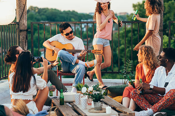 istock Hippies having fun at the roof party. 2219644585