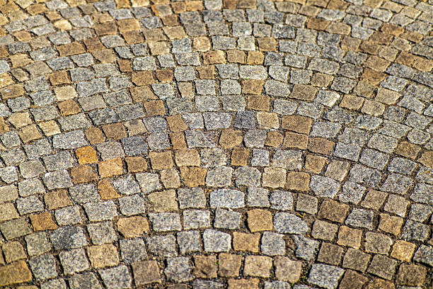 istock Close-up of old stone pavement with a curved pattern. 2219644661