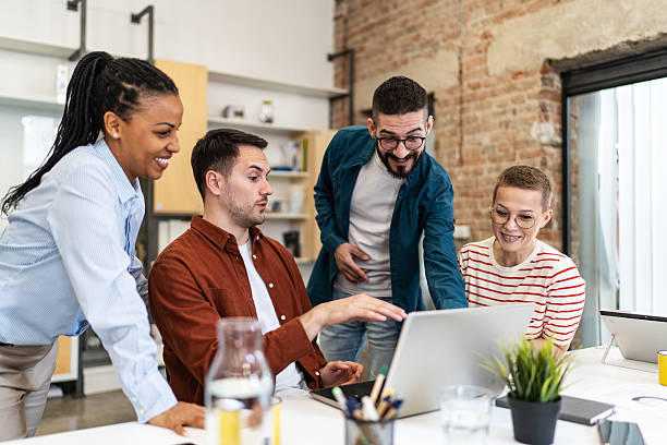 istock Business team collaborating on a project using laptop in modern office 2219645289