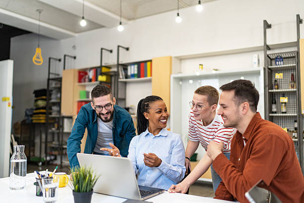 istock Young professionals collaborating on a project using laptop in the office 2219646025