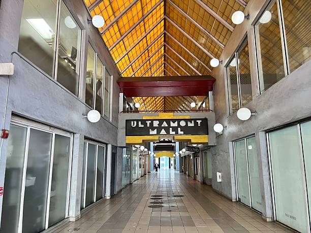 Miami, Florida, United States of America - May 7, 2025: Interior view of the deserted Ultramont Mall in Downtown Miami, Florida, featuring an empty corridor lined with closed storefronts, capturing the essence of urban decay and decline