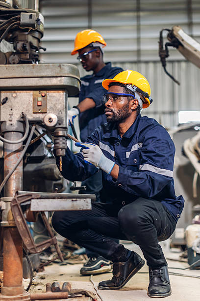 istock Workers Factory or Engineering work at factory site check up machine or products in site. Foreman or Technician checking Material or Machine on Plant. Heavy industry factory concept. 2219647070