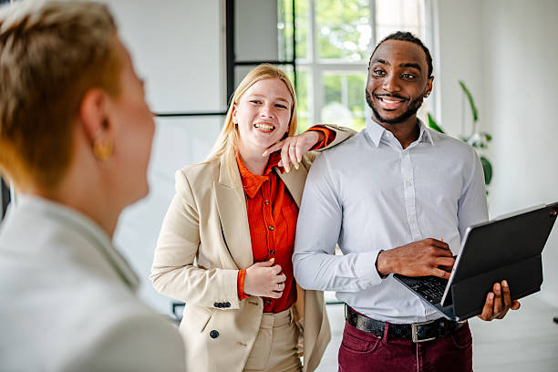istock Young black business leader engages with team in modern office setting, showcasing confidence and professionalism 2219647768