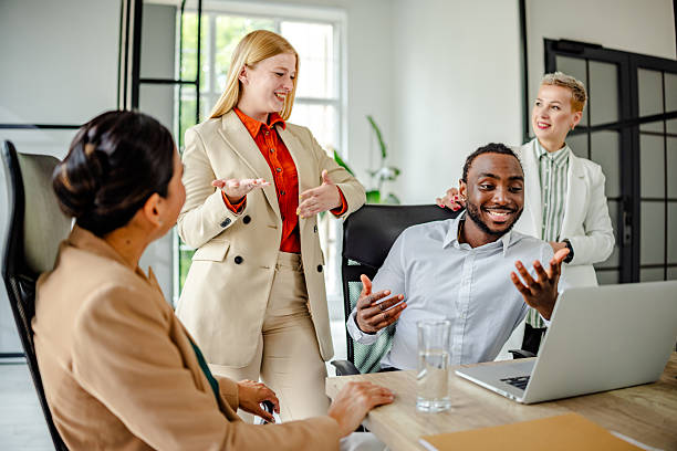 istock Dynamic leadership in a modern office setting as a young black man engages with his team during a brainstorming session 2219648818