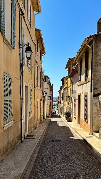 istock Steep cobblestone alley with harbor view in Cassis 2219651556