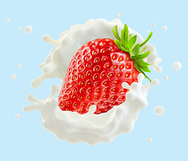 istock Strawberry and milk, cream and yogurt splash isolated on light blue background. 2219652285