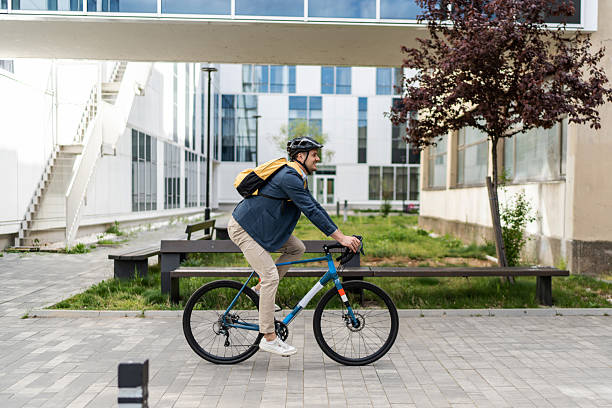 istock Young male professional cycling through modern urban environment 2219652373