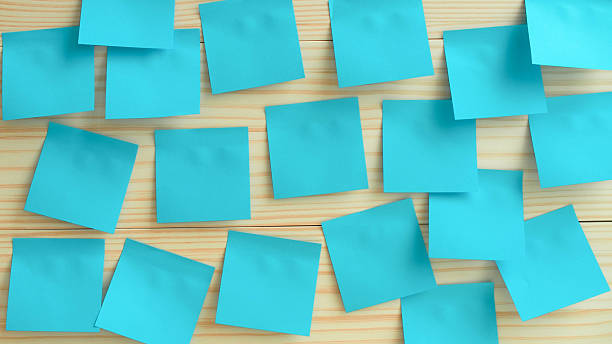 istock Many Blue Sticky Notes on Wooden Surface. Brainstorming or Planning Concept 2219652650
